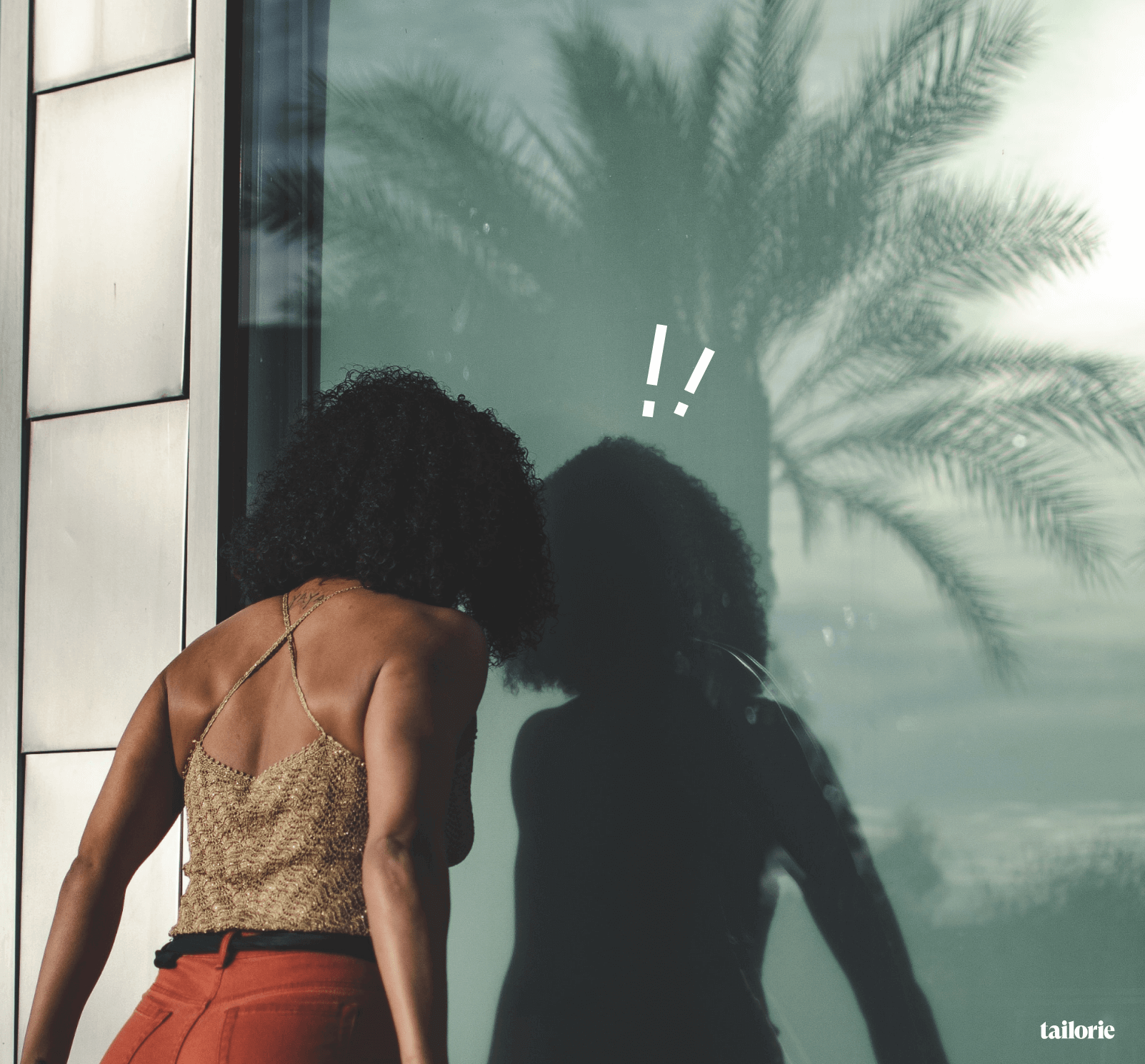 frustrated woman looking at reflection in a window