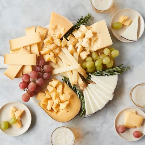 Murray's Cheese Cheeses of the World Sampler featured in Tailorie's 2024 Holiday Gift Guide For The Mom, a gourmet gift for cheese lovers.